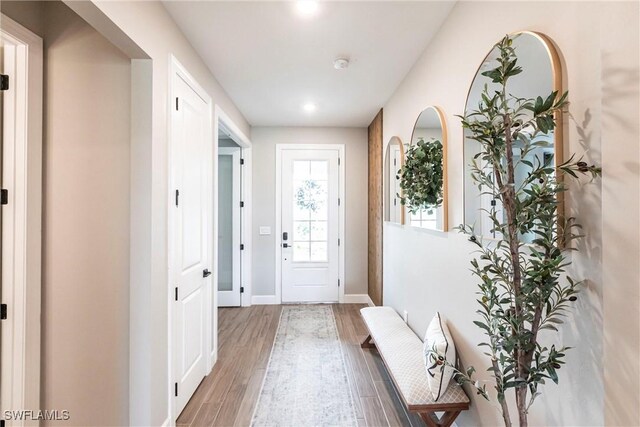 entryway with hardwood / wood-style flooring