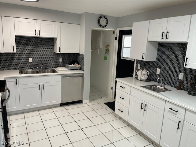 kitchen featuring white cabinets, light countertops, dishwasher, and a sink