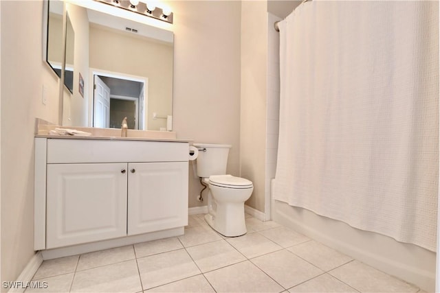 full bathroom with toilet, vanity, tile patterned flooring, and shower / bath combo with shower curtain