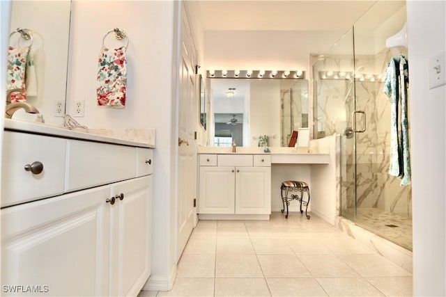 bathroom with ceiling fan, tile patterned floors, vanity, and an enclosed shower