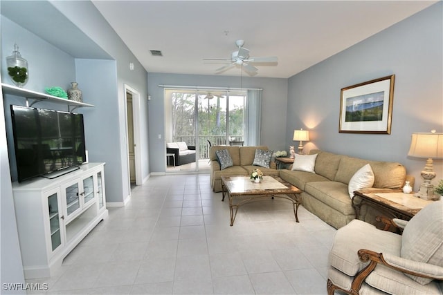 living room with ceiling fan and light tile patterned floors