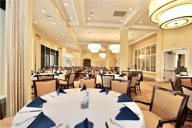 dining area featuring recessed lighting, visible vents, a towering ceiling, and ornamental molding