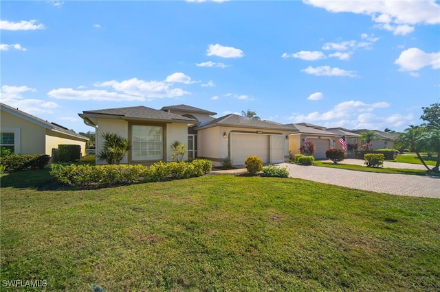 view of front of home with a garage and a front yard