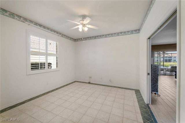 unfurnished room featuring light tile patterned floors and ceiling fan