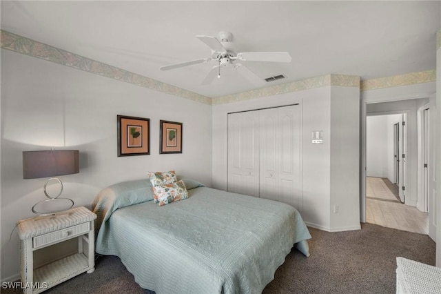 bedroom featuring ceiling fan, carpet floors, and a closet