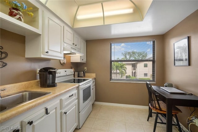 kitchen with sink, white cabinetry, and white electric range oven