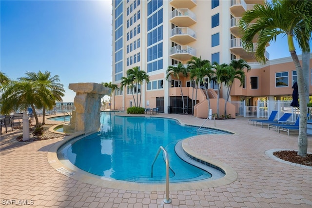 view of swimming pool with a patio