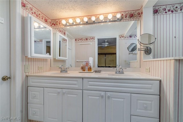 806 SE 46th St Unit 1E, Cape Coral, FL 33904 - bathroom with vanity and a textured ceiling