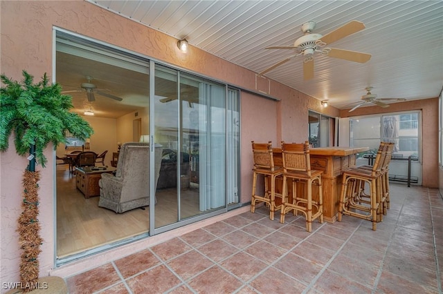 806 SE 46th St Unit 1E, Cape Coral, FL 33904 - sunroom / solarium featuring ceiling fan and indoor bar