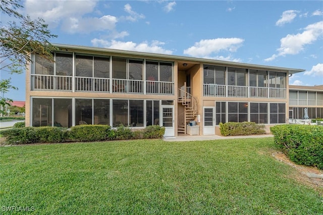 806 SE 46th St Unit 1E, Cape Coral, FL 33904 - back of house featuring a lawn