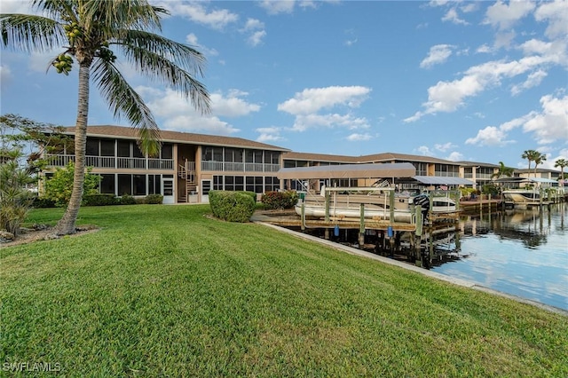 806 SE 46th St Unit 1E, Cape Coral, FL 33904 - view of dock with a yard and a water view
