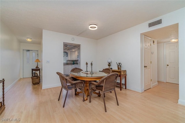 806 SE 46th St Unit 1E, Cape Coral, FL 33904 - dining space featuring light wood-type flooring