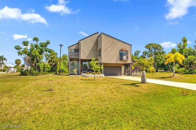 contemporary house featuring a front yard and a garage