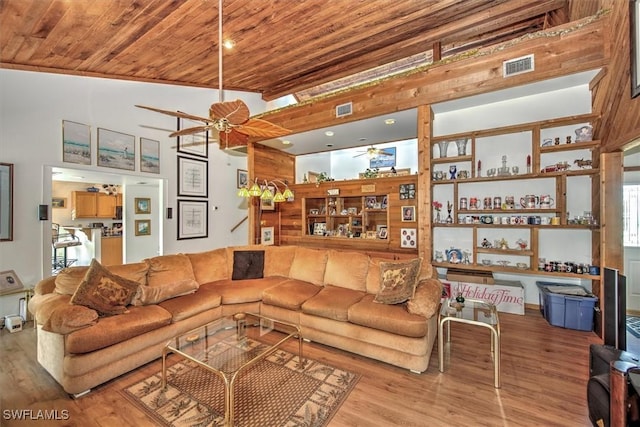 living room with ceiling fan, wood ceiling, and light wood-type flooring