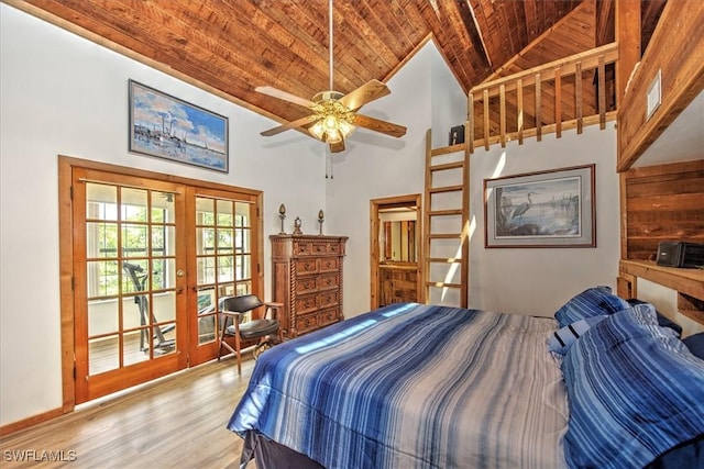 bedroom with french doors, wood ceiling, ceiling fan, hardwood / wood-style flooring, and high vaulted ceiling