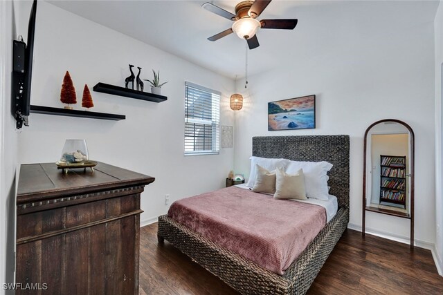 bedroom with ceiling fan and dark wood-type flooring