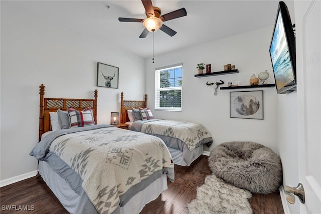 bedroom featuring ceiling fan and dark wood-type flooring