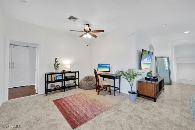 interior space featuring ceiling fan