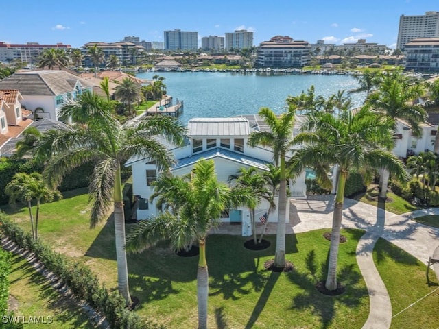 birds eye view of property with a water view