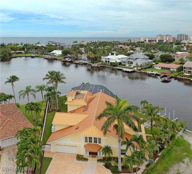 birds eye view of property featuring a water view