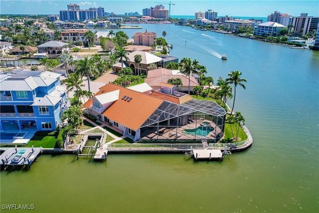 birds eye view of property with a water view