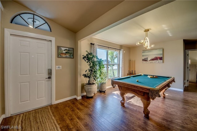 recreation room with wood-type flooring, an inviting chandelier, vaulted ceiling, and billiards