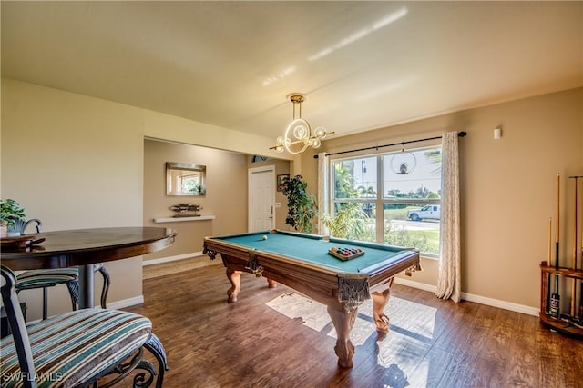 recreation room featuring dark hardwood / wood-style flooring, a chandelier, and pool table