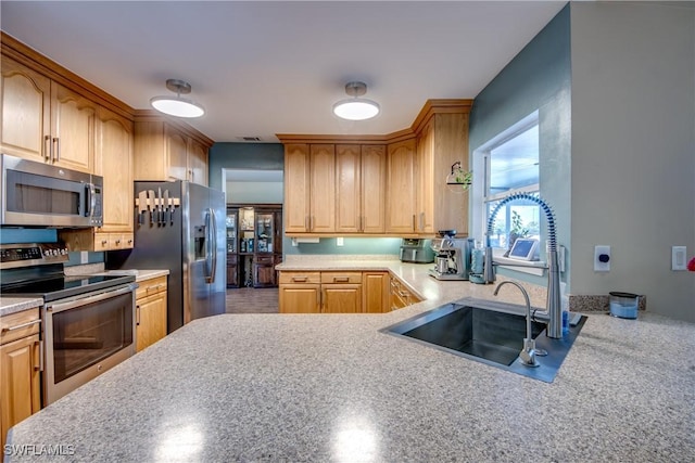 kitchen with appliances with stainless steel finishes and sink