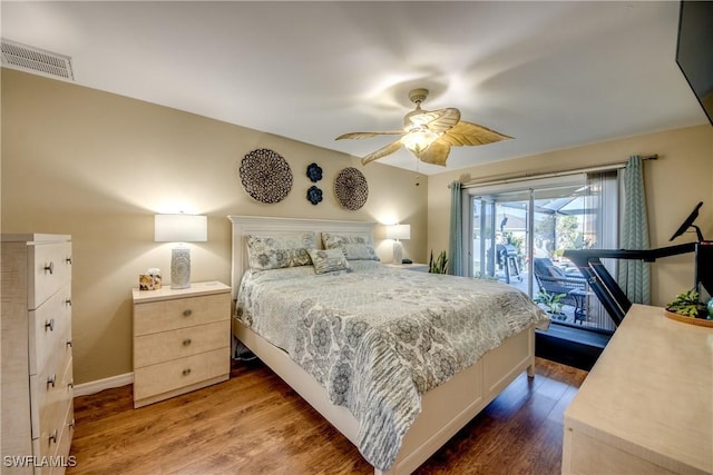 bedroom with access to exterior, hardwood / wood-style flooring, and ceiling fan