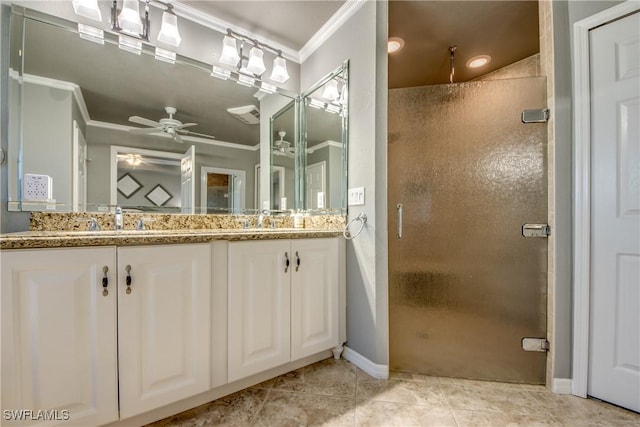 bathroom with tile patterned floors, vanity, crown molding, and walk in shower