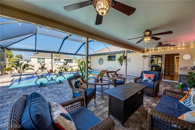 view of patio / terrace with glass enclosure, an outdoor living space, and ceiling fan