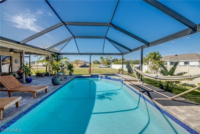 view of pool with a patio area and a lanai