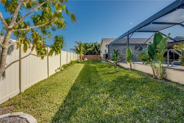 view of yard featuring a lanai