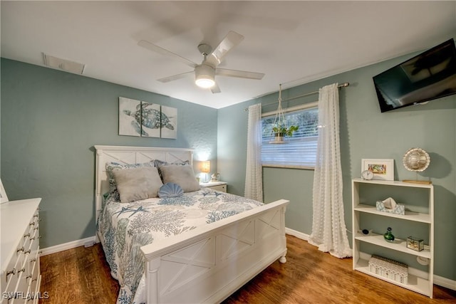 bedroom with ceiling fan and wood-type flooring