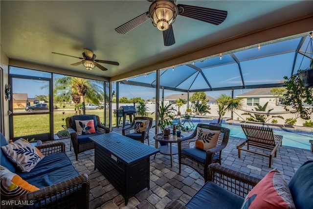 view of patio with a lanai, ceiling fan, and an outdoor hangout area