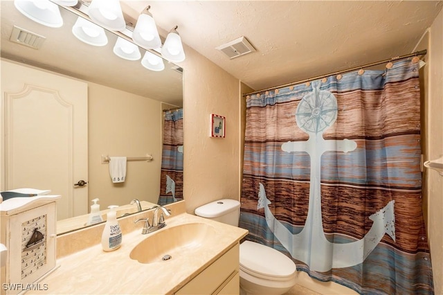 bathroom with a shower with curtain, vanity, and toilet