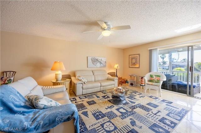 tiled living room featuring ceiling fan and a textured ceiling