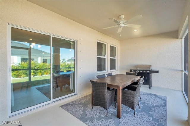 sunroom featuring ceiling fan