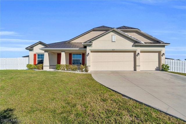 view of front of home featuring a garage and a front yard