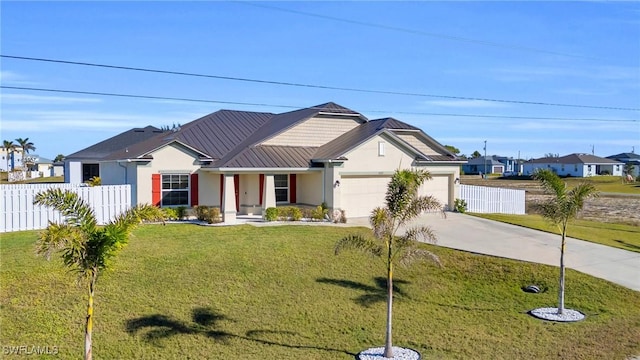 view of front of property featuring a garage and a front lawn