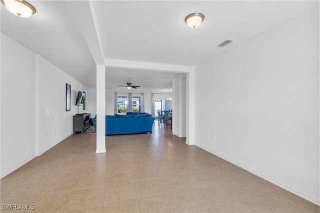 interior space featuring ceiling fan