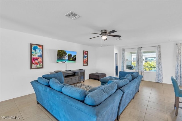 tiled living room featuring ceiling fan