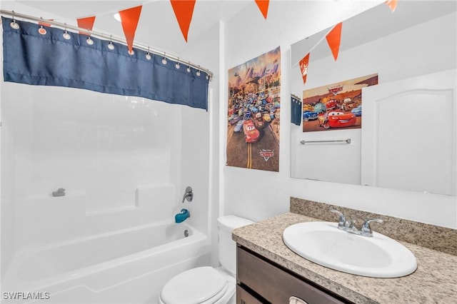 full bathroom featuring shower / bath combo, vanity, and toilet