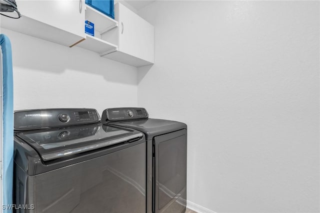 clothes washing area featuring independent washer and dryer