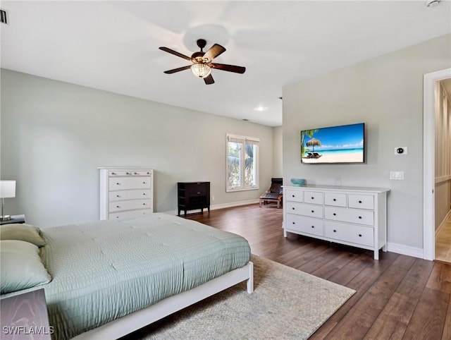 bedroom with dark wood-type flooring and ceiling fan