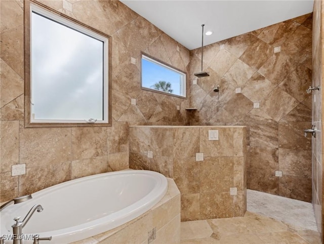 bathroom with separate shower and tub