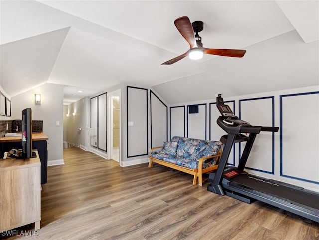 bedroom with hardwood / wood-style flooring, ceiling fan, and vaulted ceiling