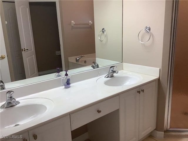 bathroom featuring a bathing tub and vanity