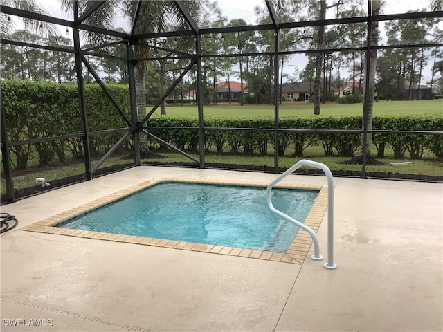 view of swimming pool featuring a lanai and a patio area