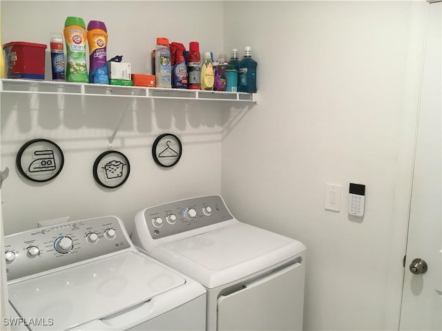 laundry area with independent washer and dryer